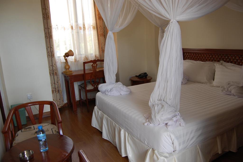 Arusha Tourist Inn Hotel Quarto foto